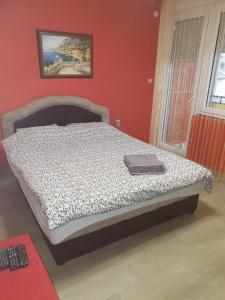 Postel nebo postele na pokoji v ubytování Kolibri 2 vendèghàz