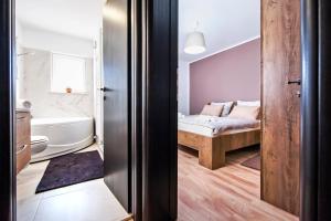 Postel nebo postele na pokoji v ubytování Apartment Miral