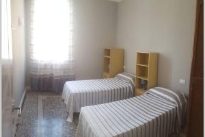 Posteľ alebo postele v izbe v ubytovaní Prestige House a pochi passi dal mare