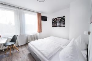 Postel nebo postele na pokoji v ubytování SOVA Hotel