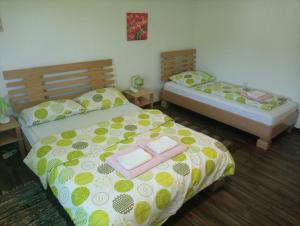 two beds in a room with two at Apartment Gradina in Korenica
