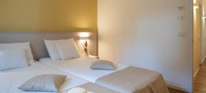 Ein Bett oder Betten in einem Zimmer der Unterkunft DIEHOLIDAYBUCHT