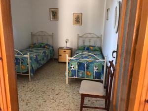 Ένα ή περισσότερα κρεβάτια σε δωμάτιο στο VILLA PINETA VISTA MARE