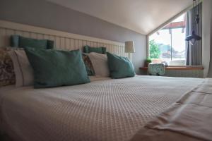 Cama ou camas em um quarto em Hotel Casa da Nora