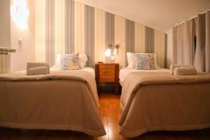 Cama ou camas em um quarto em Hotel Casa da Nora