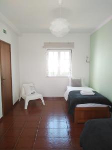 Postel nebo postele na pokoji v ubytování Ergobeach House