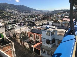 a view of a city from a gondola at Edificio Danny Javier in Quito