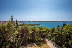a view of a body of water with trees at Villa Fani - Apartments in Trogir in Trogir
