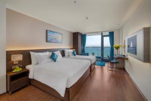 Canvas Danang Beach Hotel客房内的一张或多张床位