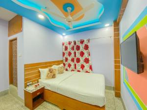 a bedroom with a bed with a blue ceiling at Hotel As Shams International in Dhaka