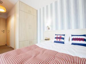 Łóżko lub łóżka w pokoju w obiekcie Porto Marina