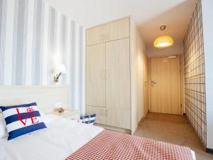 Łóżko lub łóżka w pokoju w obiekcie Porto Marina