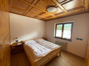 Ένα ή περισσότερα κρεβάτια σε δωμάτιο στο Casa Doleda