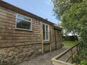 a house with a window on the side of it at Shilstone Lodge in Newton Abbot