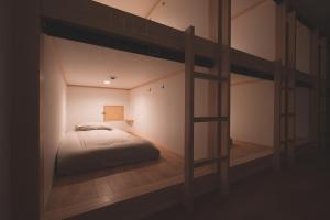 Ένα ή περισσότερα κρεβάτια σε δωμάτιο στο THY GUEST HOUSE