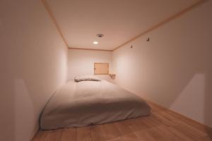 Ένα ή περισσότερα κρεβάτια σε δωμάτιο στο THY GUEST HOUSE