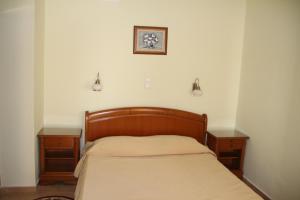 
Un pat sau paturi într-o cameră la Hotel Amiral
