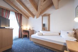 Posteľ alebo postele v izbe v ubytovaní Hotel Garni Schneider