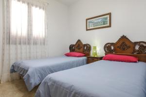Ein Bett oder Betten in einem Zimmer der Unterkunft Casa Maria Granillo