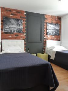 Postel nebo postele na pokoji v ubytování Rome Apartment