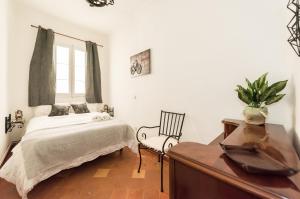 A bed or beds in a room at La Casa de Lope de Rueda