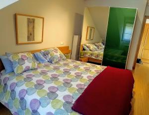 A bed or beds in a room at Los Molinos - Atico en Montaña de Asturias