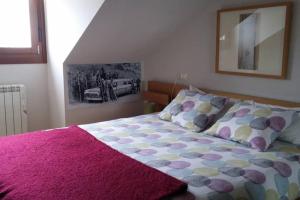 A bed or beds in a room at Los Molinos - Atico en Montaña de Asturias