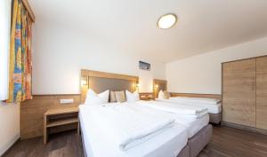 Posteľ alebo postele v izbe v ubytovaní Appartements Waldesrand