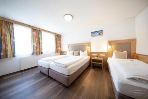 Posteľ alebo postele v izbe v ubytovaní Appartements Waldesrand