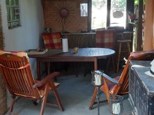 a dining room table with two chairs and a table at Ferienwohnung Jacqueline in Erbach im Odenwald