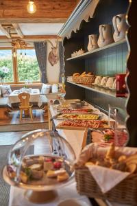 a buffet in a restaurant with a lot of food at Sportpension Enzian in Saalbach-Hinterglemm +80 photos