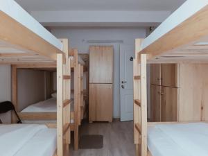 Ένα ή περισσότερα κρεβάτια σε δωμάτιο στο Bloom Inn