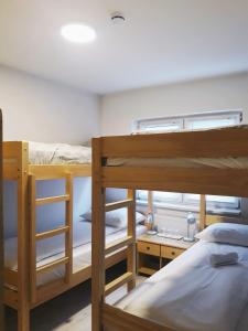 Ένα ή περισσότερα κρεβάτια σε δωμάτιο στο Bloom Inn