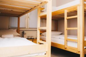 Ένα ή περισσότερα κρεβάτια σε δωμάτιο στο Bloom Inn