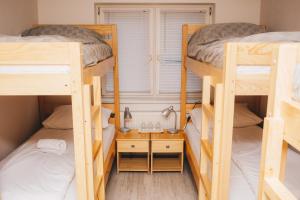Ένα ή περισσότερα κρεβάτια σε δωμάτιο στο Bloom Inn