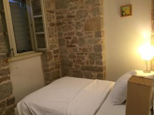 Postel nebo postele na pokoji v ubytování Hotel Maestral
