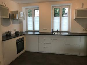 Kuchyň nebo kuchyňský kout v ubytování Frundsberg-Apartment