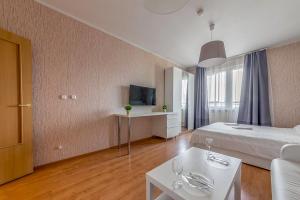 TV in/ali zabaviščno središče v nastanitvi Apartment Hanaka Jubileinyi 72