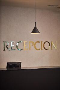 a sign that says regorian on a wall at Silken Coliseum in Santander