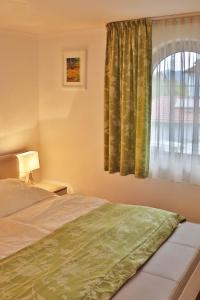 Postel nebo postele na pokoji v ubytování Fischerhof Appartements