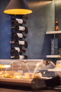 a bunch of wine bottles in a wine rack at Silken Coliseum in Santander
