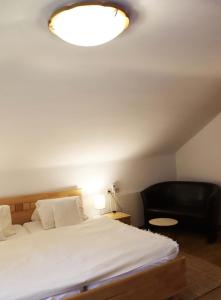 Postel nebo postele na pokoji v ubytování Fischerhof Appartements