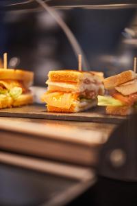 a sandwich is cut in half on a plate at Silken Coliseum in Santander