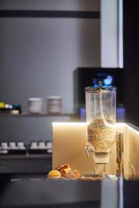 a blender sitting on top of a box with donuts at Silken Coliseum in Santander