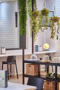 a room with a table with plants on it at Silken Coliseum in Santander