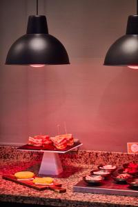 a buffet of food on a table in a restaurant at Silken Coliseum in Santander