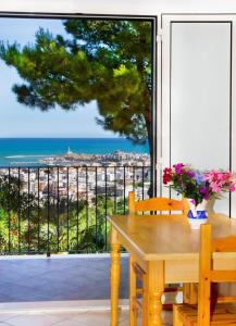 a dining room table with a view of the ocean at Residence Chiesiola in Vieste