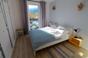 Posteľ alebo postele v izbe v ubytovaní Apartament Włochatka z sauną fińską