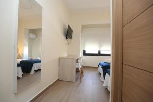 Postel nebo postele na pokoji v ubytování H.PALMONES