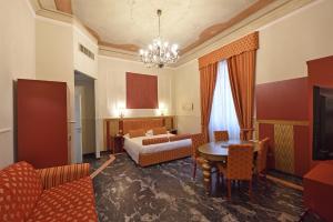 Postel nebo postele na pokoji v ubytování Relais La Corte di Cloris